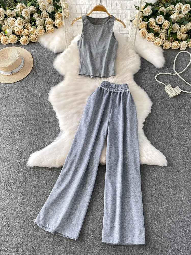 

Чрезвычайно простой стиль, сплошной цвет, дизайн, сексуальный короткий жилет с бретельками на спине + эластичный комплект с широкими брюками для похудения с высокой талией