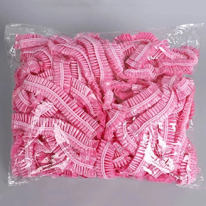 100 stks/set Wegwerp Douchekappen Plastic Waterdichte Hoofddeksels Roze Spa Salon Hotel Haarverf Vrouwen Elastische haarkap Badkamer