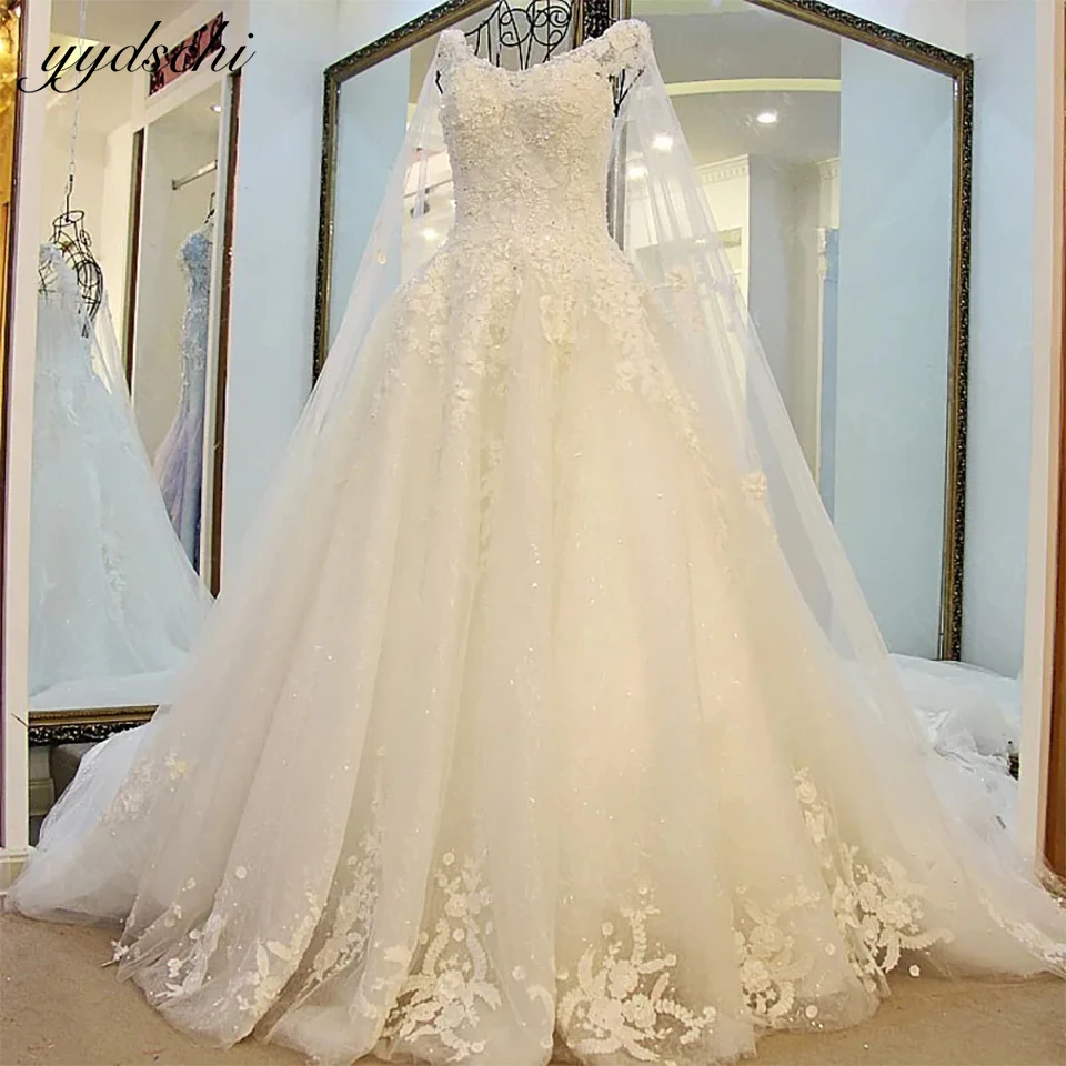 

White 3D Lace Appliques Ball Gown Wedding Dress With Cape 2023 Princess Sparkly Beading Sleeveless Bridal Gowns Vestido De Noiva