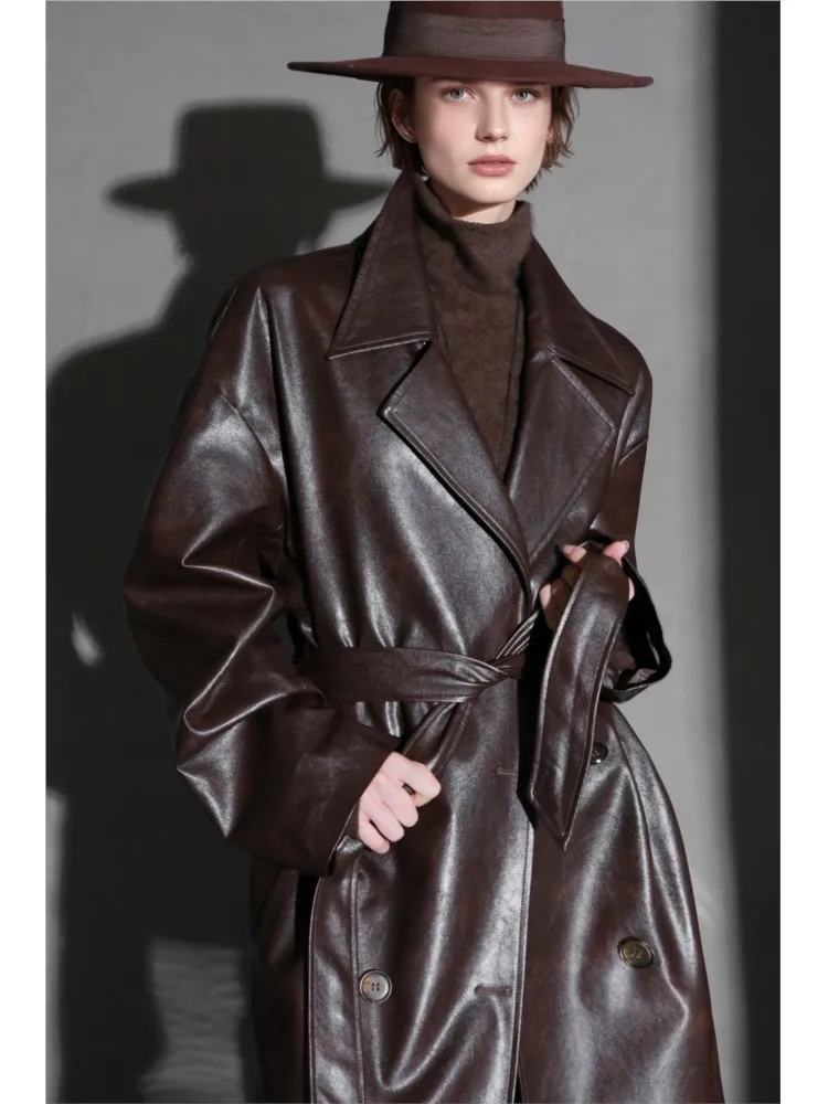A light luxury fashionable niche and cool leather trench coat for women loose mid-length