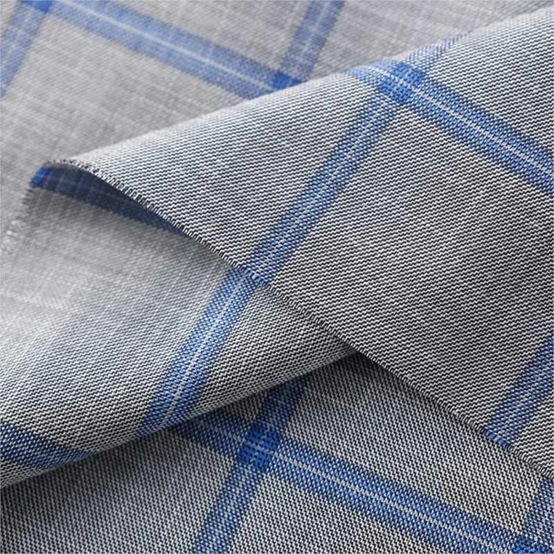 De stof voor modieuze heren- en damescasual pakken, werkkleding, rokken, broeken