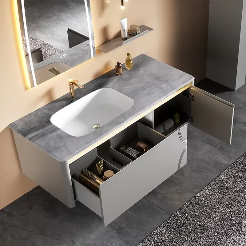 Bathroom Vanity Featuring a Stone Countertop and Integrated Ceramic Sink, a Smart Mirror, and a Wall-mounted Cabinet.