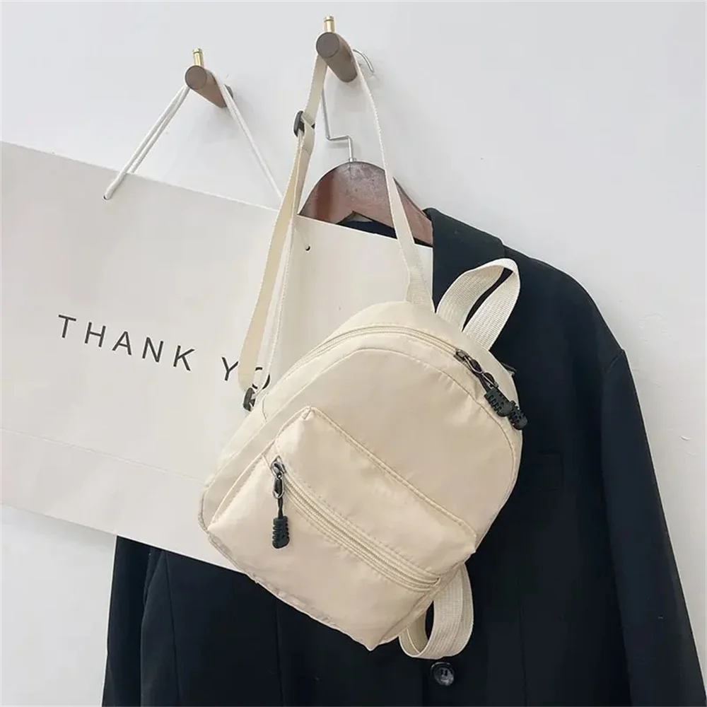 Mini sac à dos en nylon blanc pour adolescentes, sac à dos tendance pour femme, petit sac d'école pour femme, sac à dos décontracté à la mode, 1PC