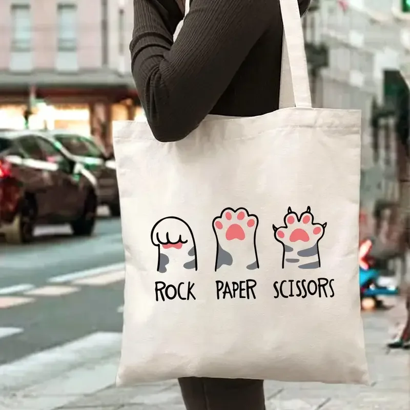 Bolso de mano de lona con estampado de letras de piedra, papel y tijera de pata de gato, ideal para compras diarias, la escuela o el uso casual.