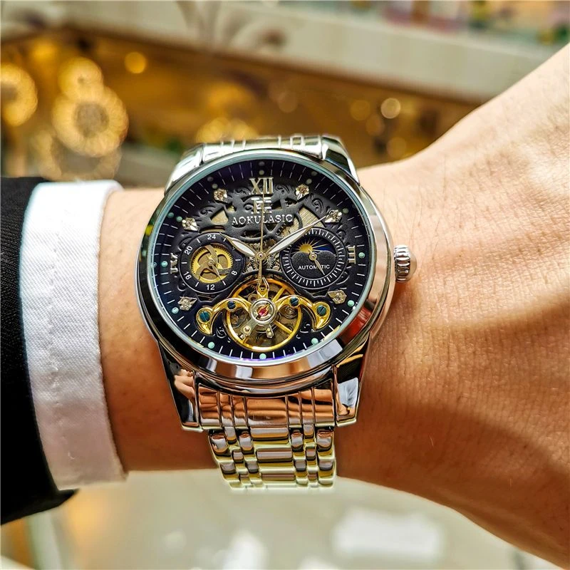 

Высококачественные, легкие роскошные, элегантные мужские автоматические механические часы, механизм с турбийоном, дизайн скелета, ремешок из нержавеющей стали, дисплей фазы Луны на циферблате - идеально подходит для делового или повседневного ношения, ром