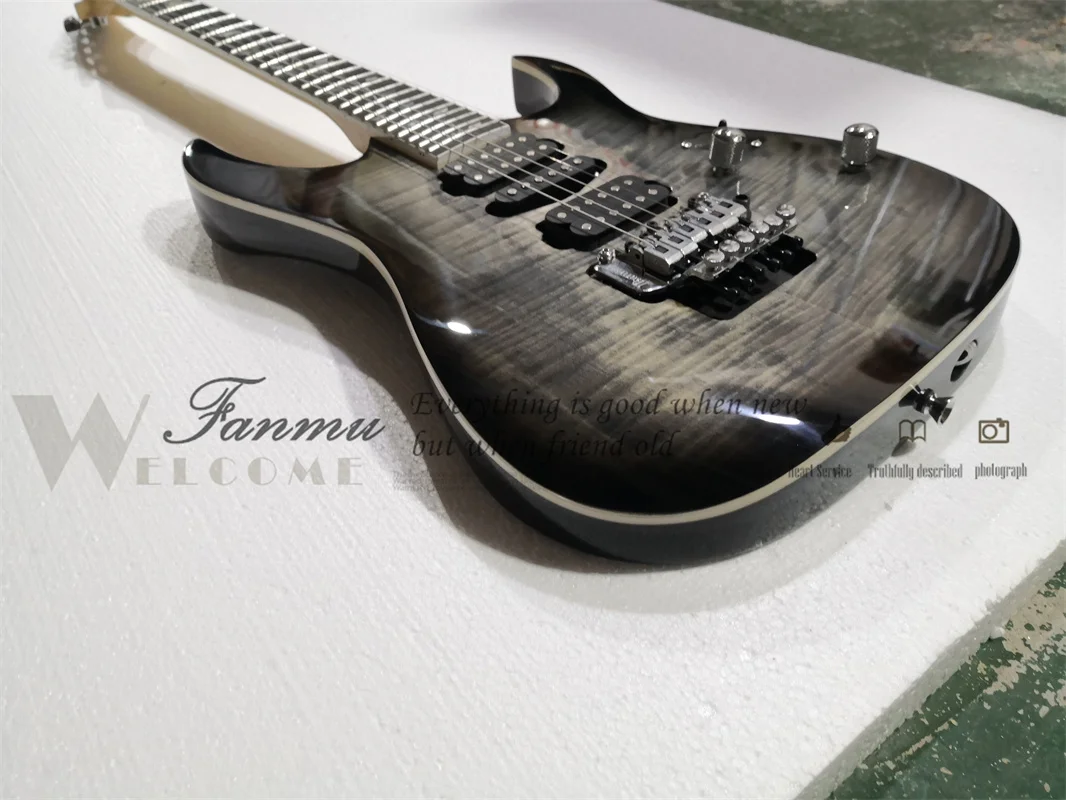 6 string electric guitar, black guitar, flamed maple veneer, flower fretboard, tremolo bridge, 5 pieces of wood neck