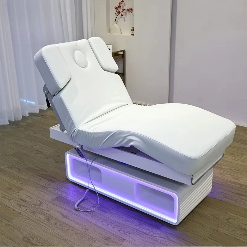Modern and comfortable electric beauty bed with LED lighting base, ergonomic design, suitable for beauty salon furniture