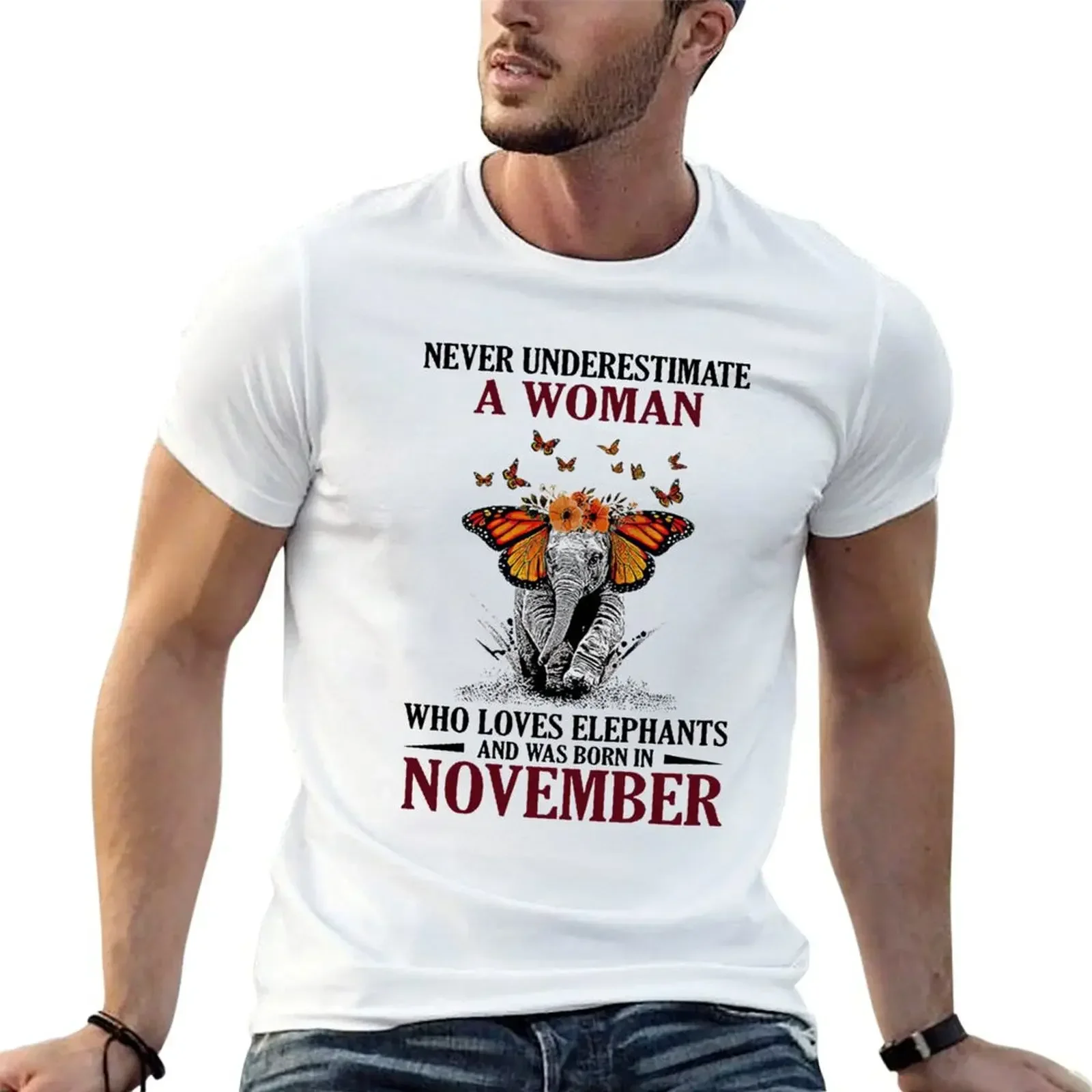 

Never underestimate a woman who loves elephants and was born in november elephants butterfly flowers T-Shirt