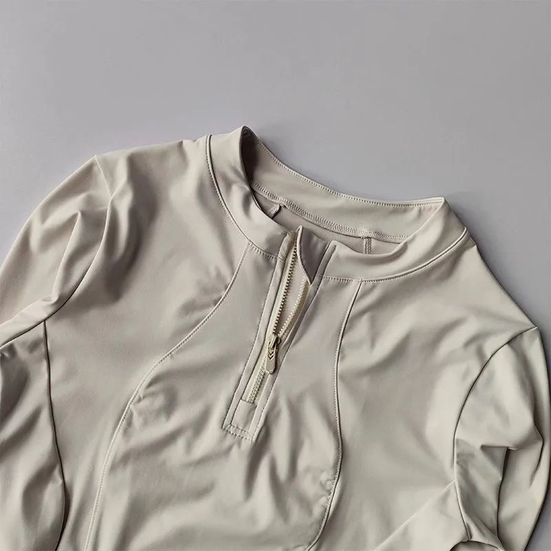 Traje de fitness con media cremallera elástica para ejercicio de yoga de manga larga ajustado para mujer para uso activo