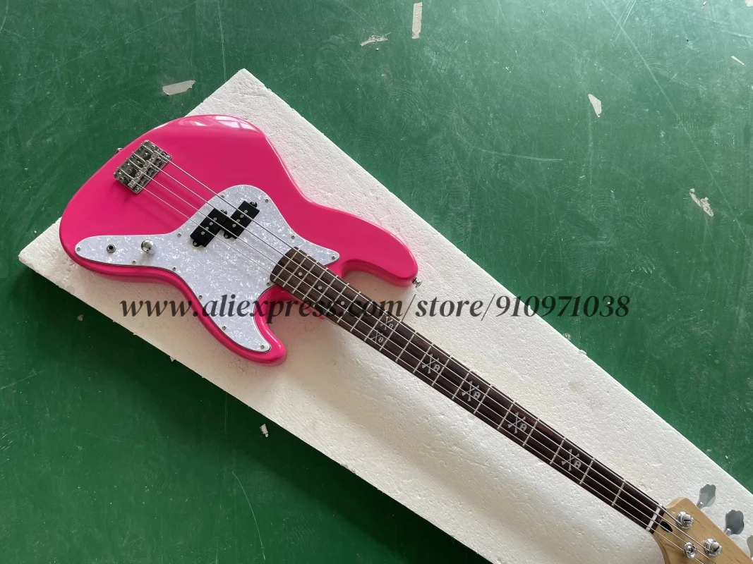 Pink bass guitar, fixed bridge, skull-shaped inlay fretboard, solid wood body, maple neck, white pearl pickupguard, customizable