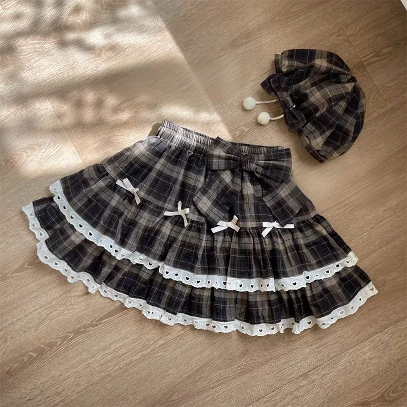 Cute and casual A-line fluffy skirt with group bow decoration, spring college style women's short skirt 2026 new style