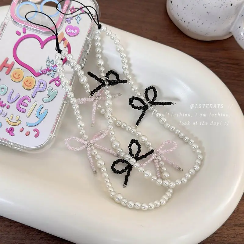 Korean ins niche blogger with the same bow pearl mobile phone chain sweet pendant mobile phone case pendant accessories