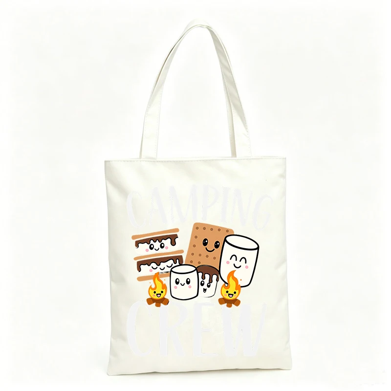 Camping enthusiasts' canvas tote bag with smiling marshmallow and cookie graphics, casual style for outdoor trips and summer