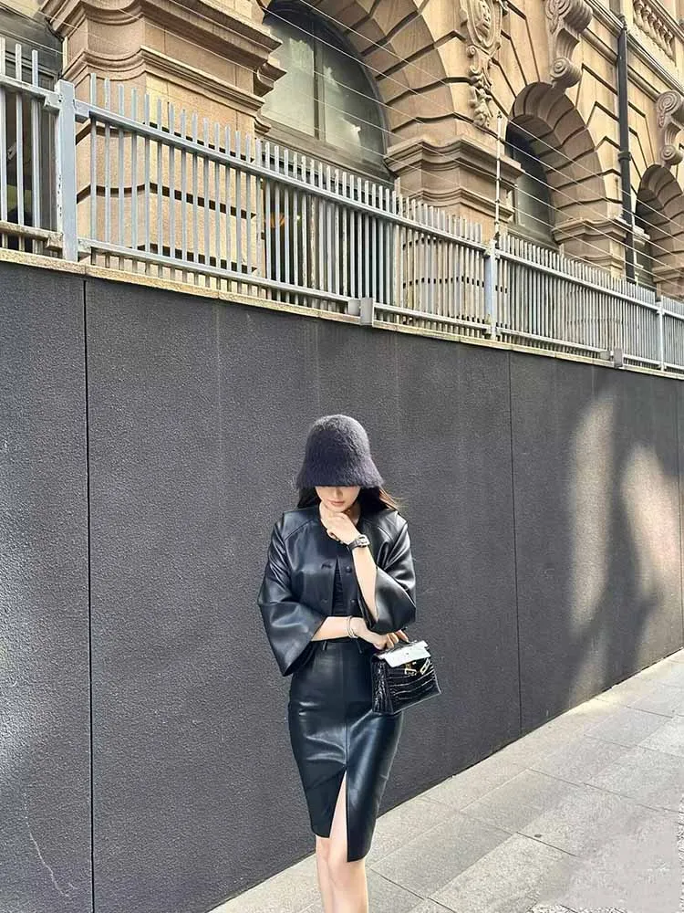 تنورة جلدية سوداء للنساء للخريف PU ميدي تنورة مجسّمة مكتب مثير عالية الخصر فتحة أمامية/خلفية متوفرة بمقاسات تصل إلى 5XL