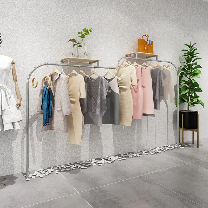 Clothing store display shelves on the wall Stainless steel supports custom hanging clothes shelves Korean women's clothing store