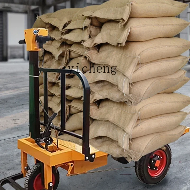 

electric flatbed truck handling construction site transportation small three-wheeled trolley