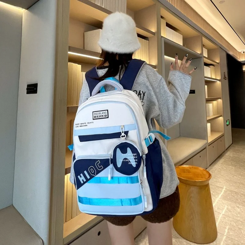 2025New Student Trendy Casual Large Capacity Waterproof Nylon Fabric Spliced Air Cushion Strap Backpack