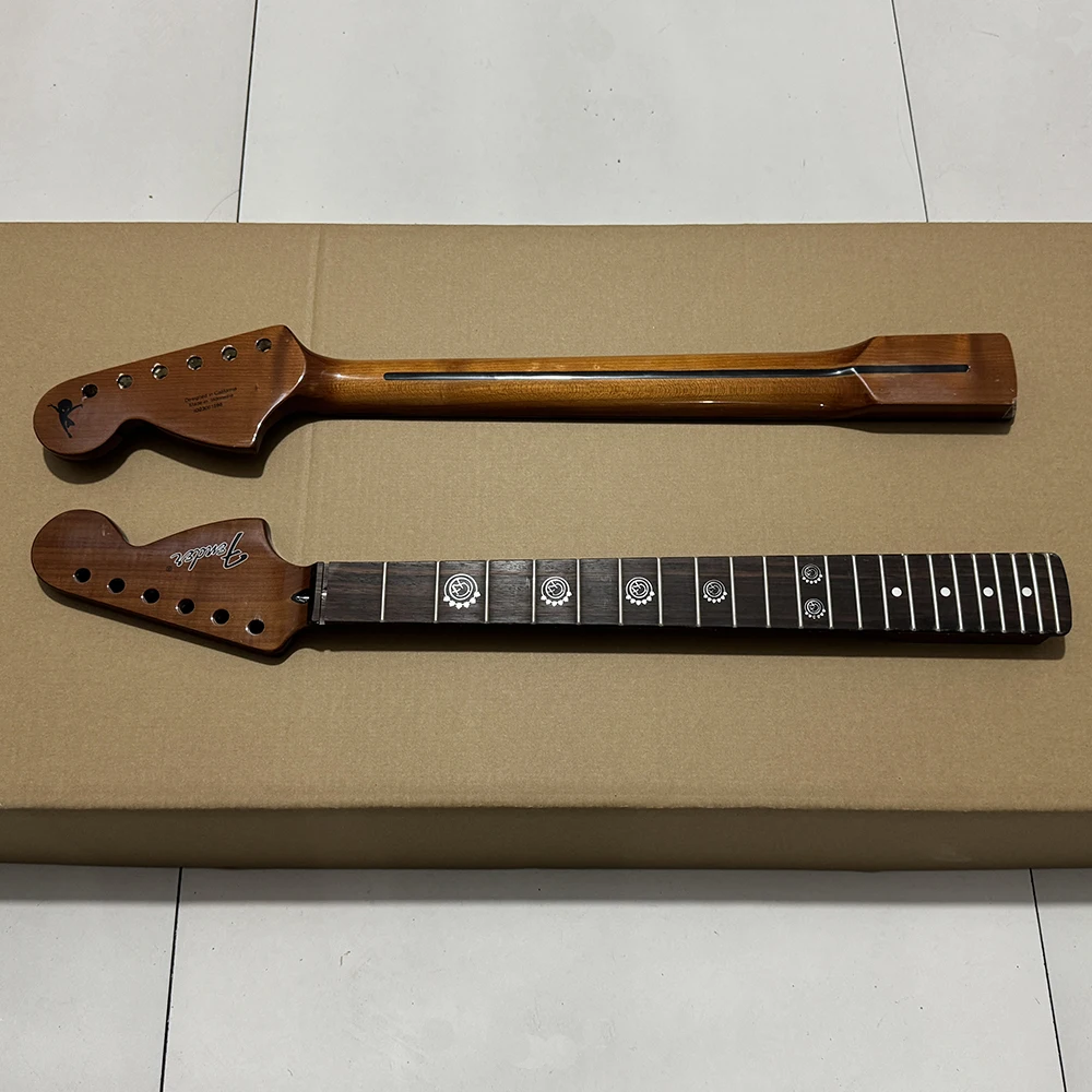 

Charred maple guitar head, rosewood fingerboard, custom inlay