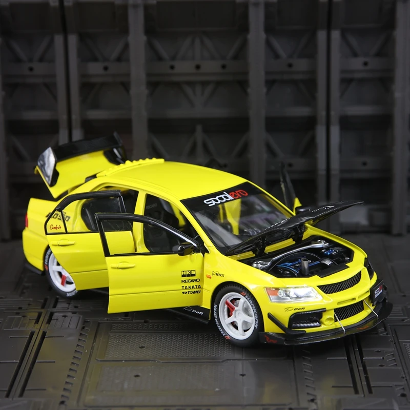

1:24 simulation Mitsubishi EVO 9 alloy car model doors and engine hood, trunk can be opene has simulated sound and lighting