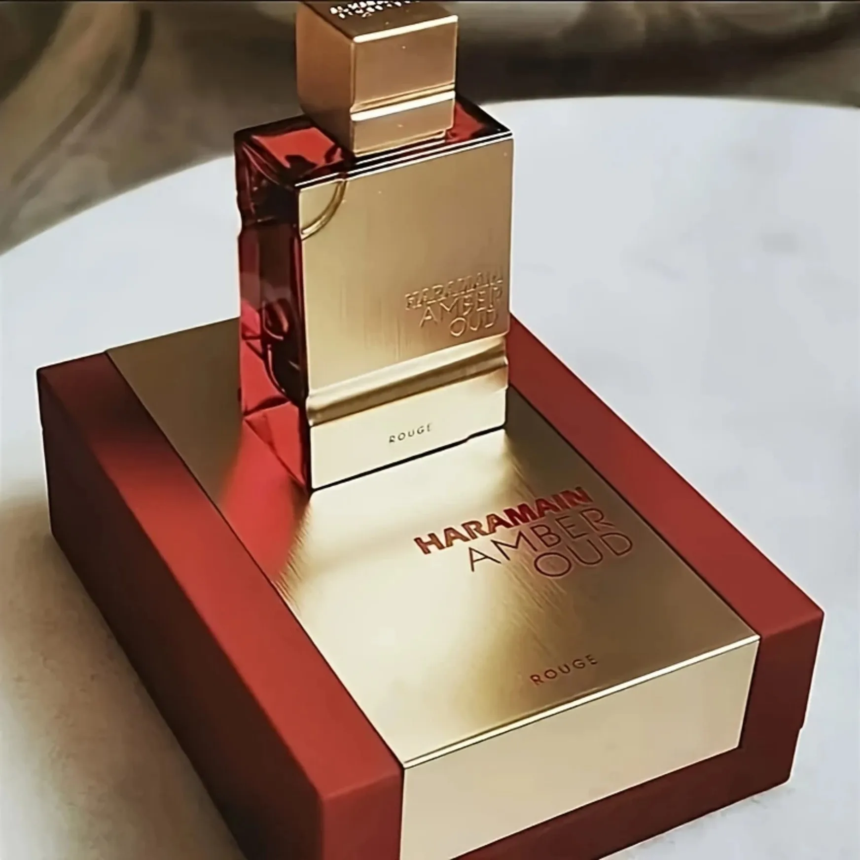 

Al Haramain Amber Oud Rouge Eau de Parfum: Luxe Gold Bottle, Warm Spicy Scent for Unisex