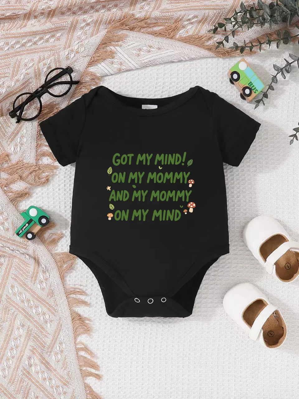 Playful letter-printed baby short-sleeve triangle bodysuit. Button closure for easy dressing, machine washable