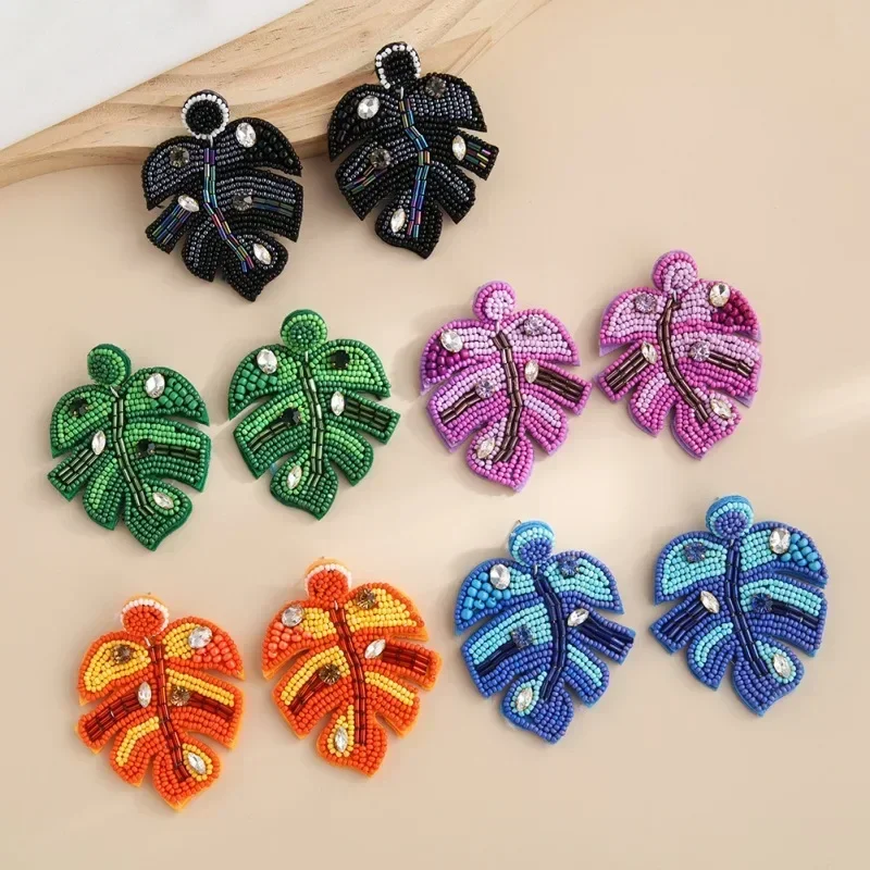 

Beaded earrings Leaf Graph Originality Female Fabric art Hand knitting Bohemia Alloy Tide Simple Geometry Rice bead earrings