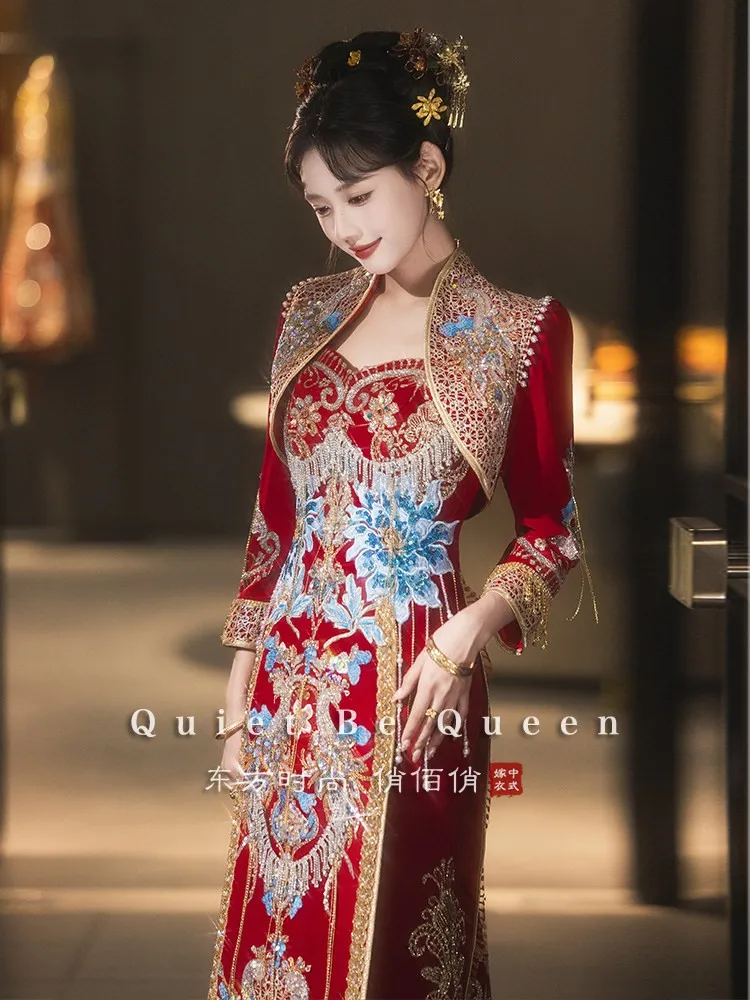 New Chinese-style wedding dress with a long tail featuring phoenix crown and red veil as well elaborate dazzling attire