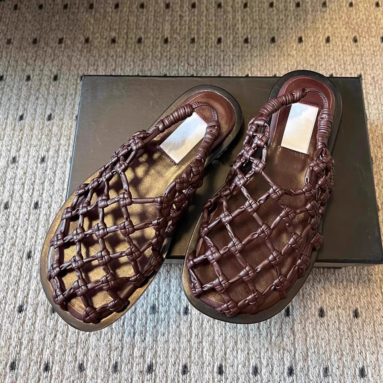 

Summer 2026 hollowed out handmade woven hollowed out sandals for women with round toe flat sandals and a straight strap