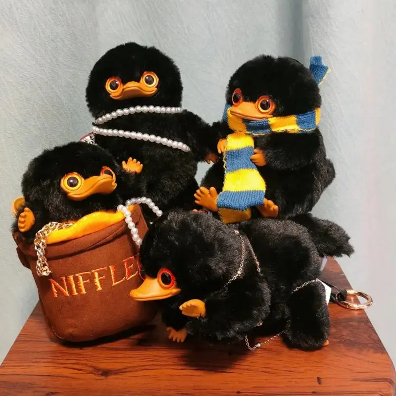 

В наличии: Новая оригинальная виниловая фигурка Ниффлера из «Фантастических зверюшек» Гарри Поттера, брелок-подвеска, таинственная коробка, фигурка для декора, подарок