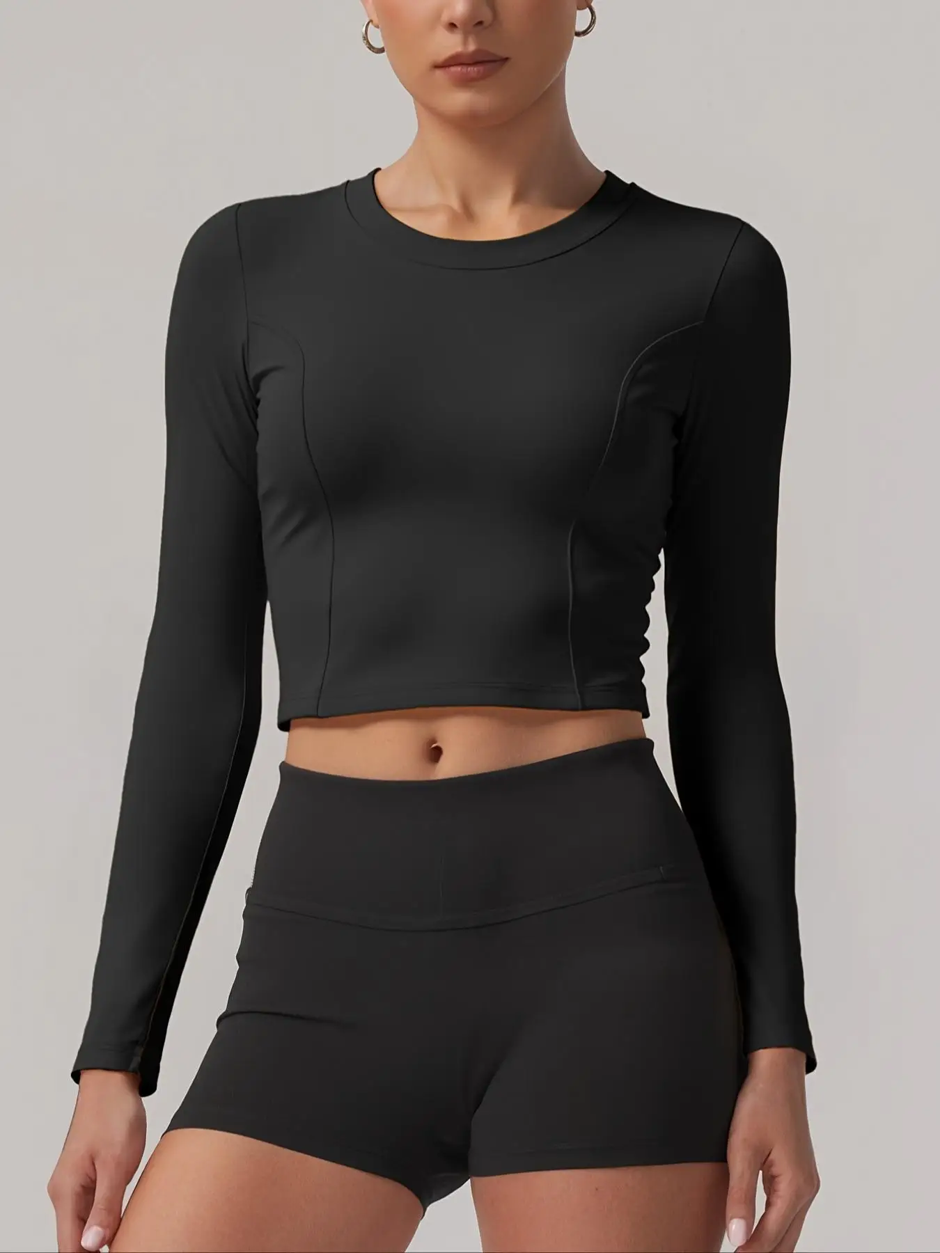 Women's long - sleeve sports top with a chest pad - moisture - wicking, featuring a sexy open - back cut and ruched drawstring d