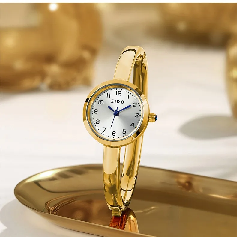 

Elegant women's wristwatch, bracelet watch, small dial, luxurious feel, diamond hour markers, oval shape, ladies' watch.