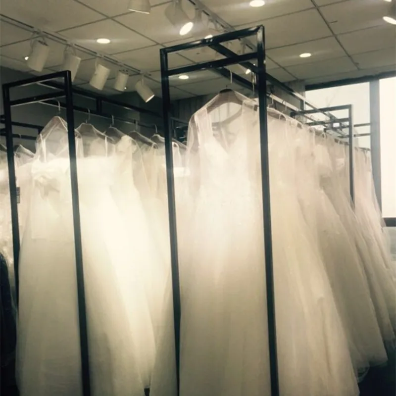 متجر لبيع ملابس الزفاف بدلة فستان رف شماعات معلقة للتصوير الفوتوغرافي لحفلات الزفاف بناء قوي على الأرض عرض موقف فستان شيونغسام