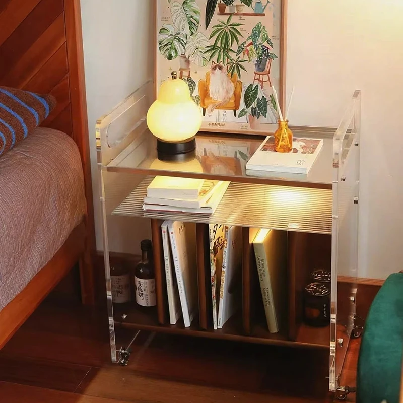 Medieval style movable record player, acrylic storage shelf, a few bedside trolleys by the sofa, wooden bookcase