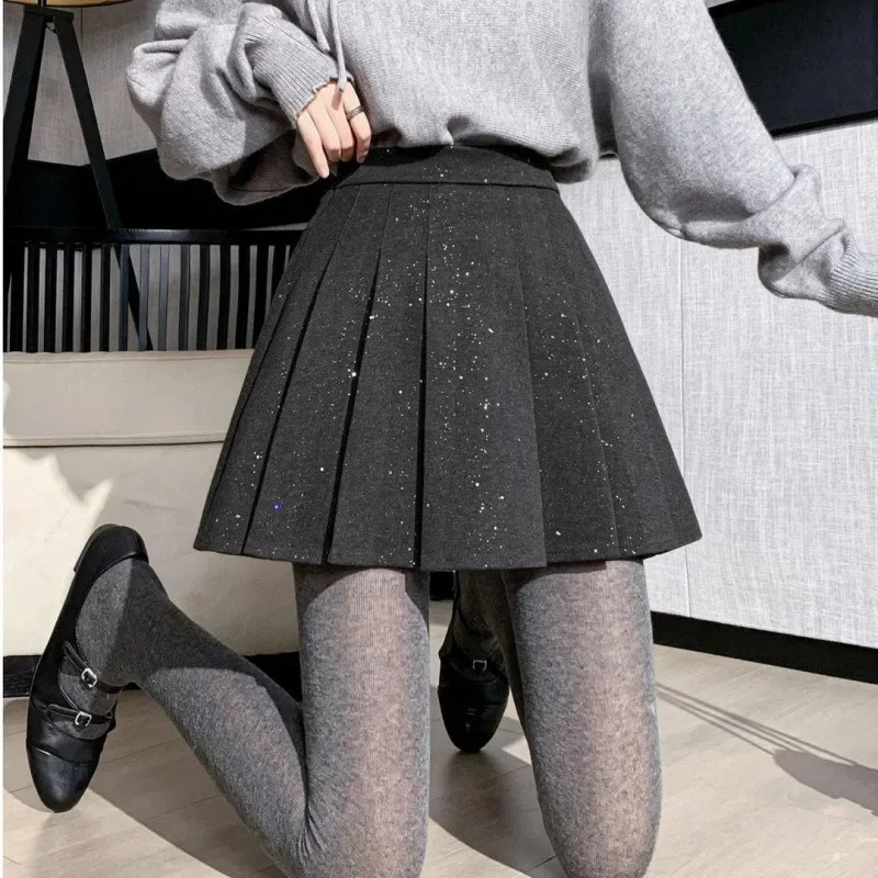 

Korean black fashion temperament high waist pleated skirt women's autumn and winter new shiny slim foreign woolen skirt