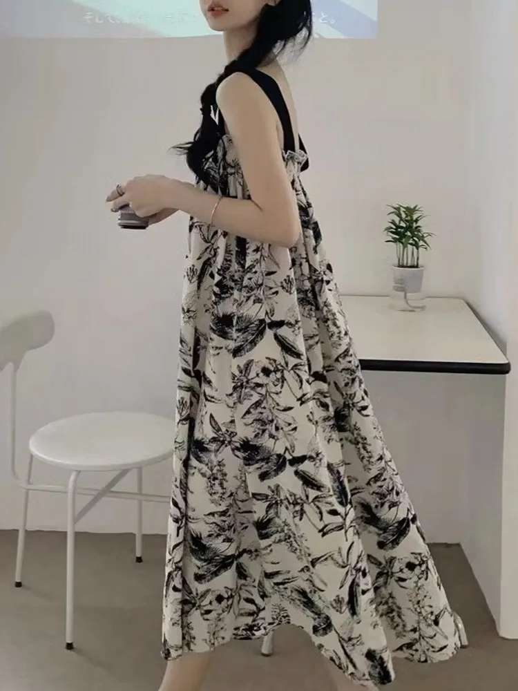 ชุดเดรสยาวทรงเอไลน์ผ้าชีฟองพิมพ์ลายดอกไม้สีน้ำ สไตล์ลำลองสำหรับฤดูร้อน เหมาะสำหรับใส่ไปเที่ยวชายหาด ช่วยพรางหุ่นให้ดูเพรียวบาง