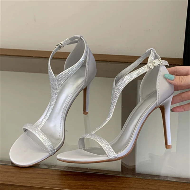 

Сексуальные женские босоножки Aneikeh с серебристыми стразами, на высоком тонком каблуке, с открытым носком и ремешком на щиколотке, для свадьбы, вечеринки, торжественных мероприятий, туфли-лодочки