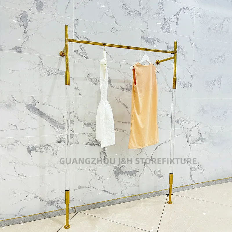 متجر ملابس النساء حامل ملابس أكريليك من الفولاذ المقاوم للصدأ تصميم مخصص رف عرض الملابس المثبت على الحائط