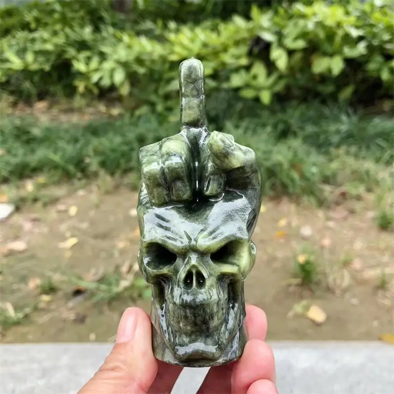Natural Ophiolite Middle Finger Gesture Skull Carving Reiki Healing Feng Shui Home Decoration Stone Statues Gift 1PCS