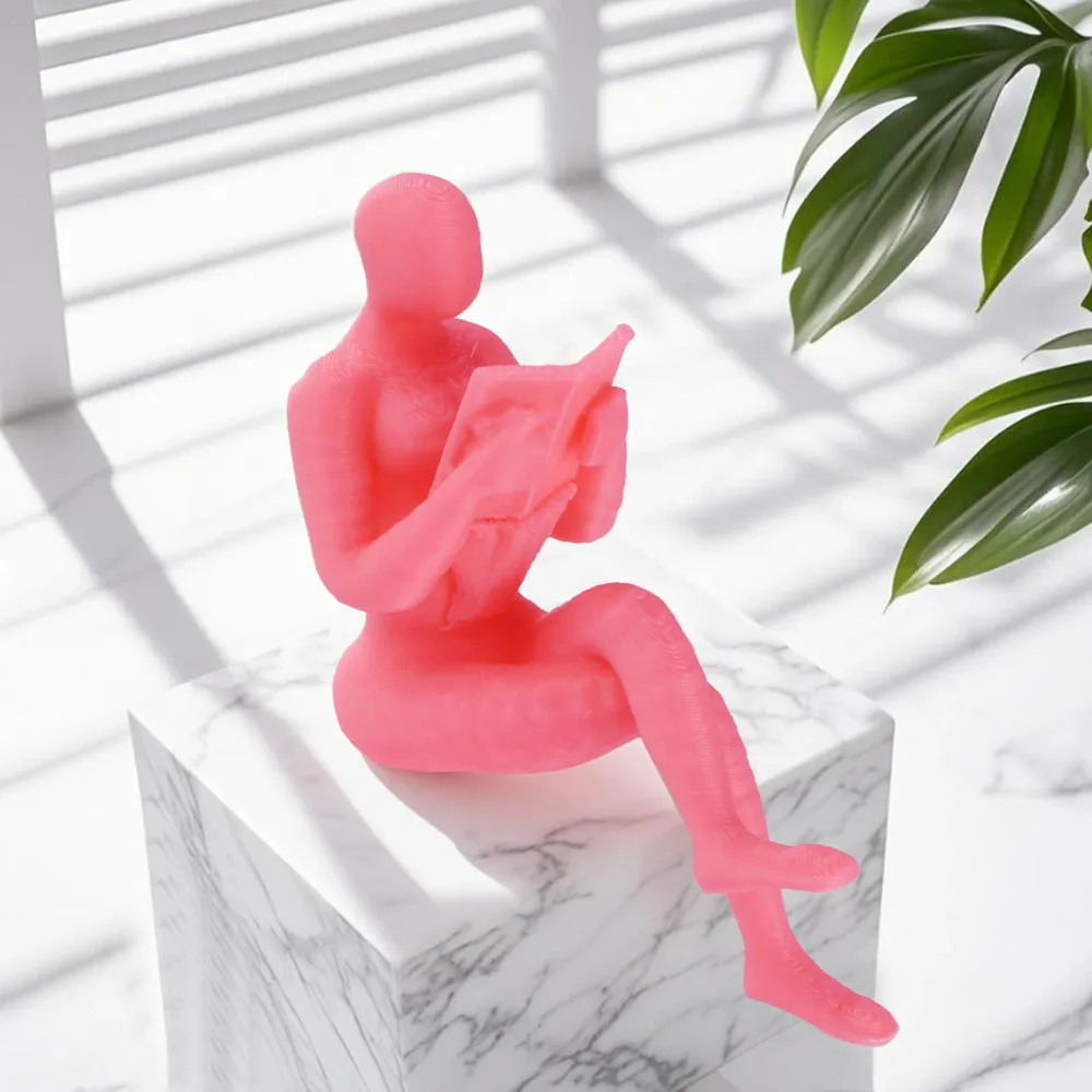 A pink reader statue, suitable for decoration on bookshelves or desks
