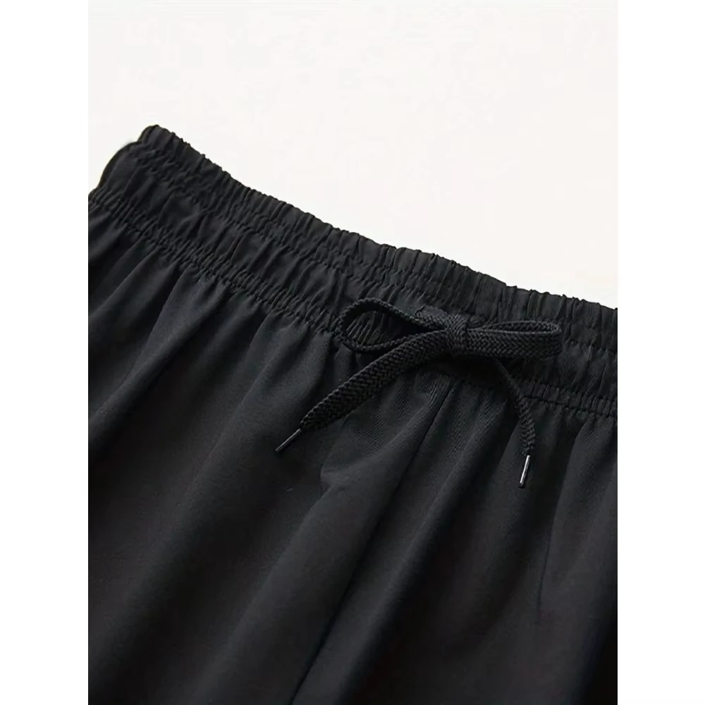 شورت جري نسائي فضفاض مناسب لليوجا واللياقة البدنية مع حزام خصر برباط وجيوب شورت y2k أسود