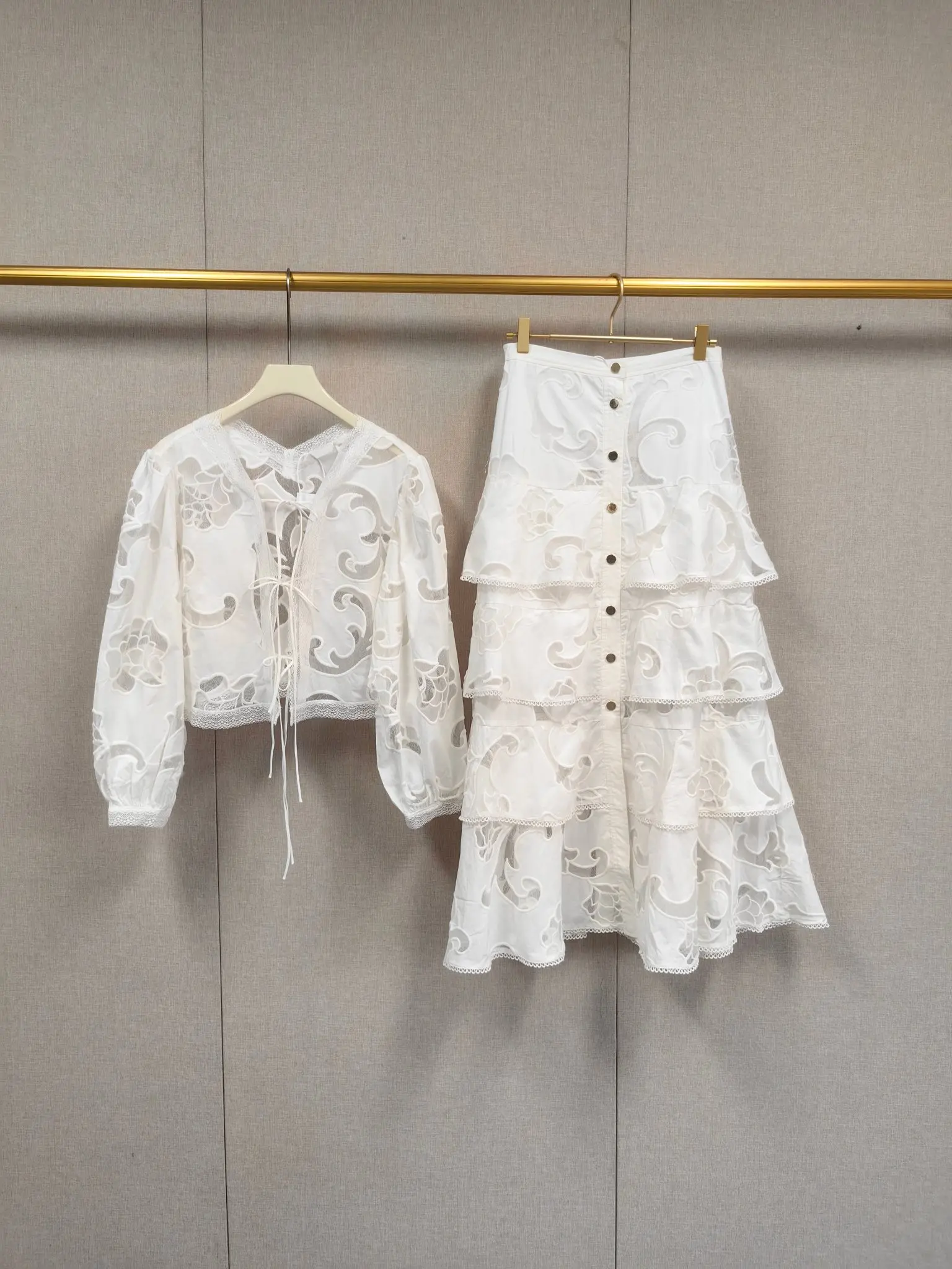 

2026 Spring/Summer Women V-Neck Hollow Embroidered Lace Set Long Sleeve Blouse + Hign Waist A-Line Tiered Pleated Midi Skirt