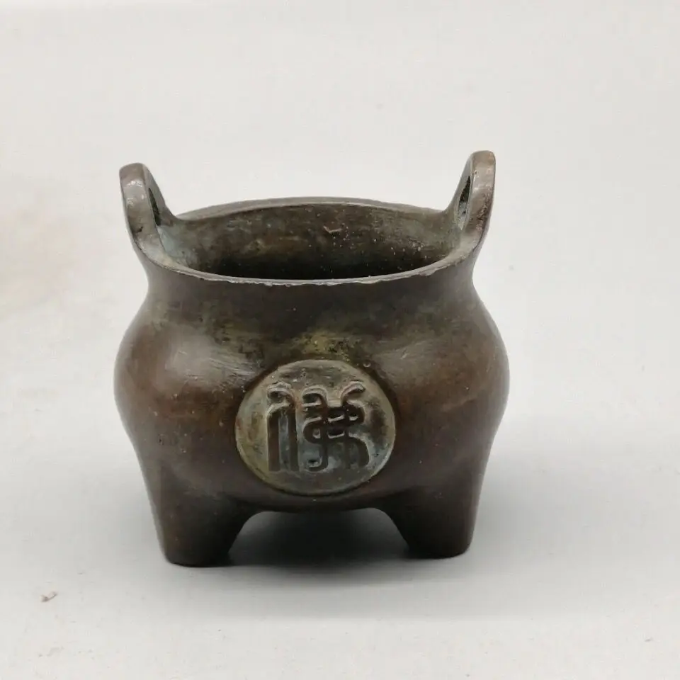 

Small incense burner with wrapped Buddha-shaped ears, round belly, three-legged Zen bronze mini Xuande