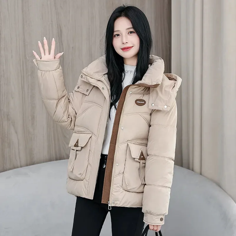 เสื้อแจ็คเก็ตผ้าฝ้ายสำหรับฤดูหนาว แจ็คเก็ตผ้าฝ้ายบุนวมสำหรับผู้หญิงแบบใหม่ ทรงหลวม หนา อุ่น มีฮู้ดถอดได้ เสื้อคลุมกันหนาวแบบมีซับใน