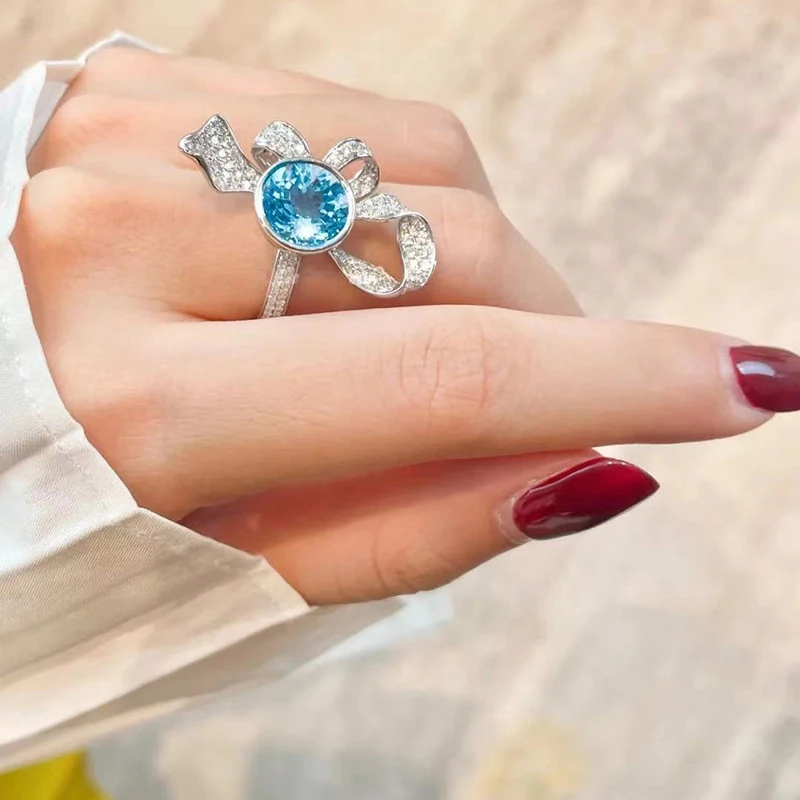 Romantic and creative sky blue gemstone winding flower rings for women inspiration diamond inlay bowknot ring wedding jewelry