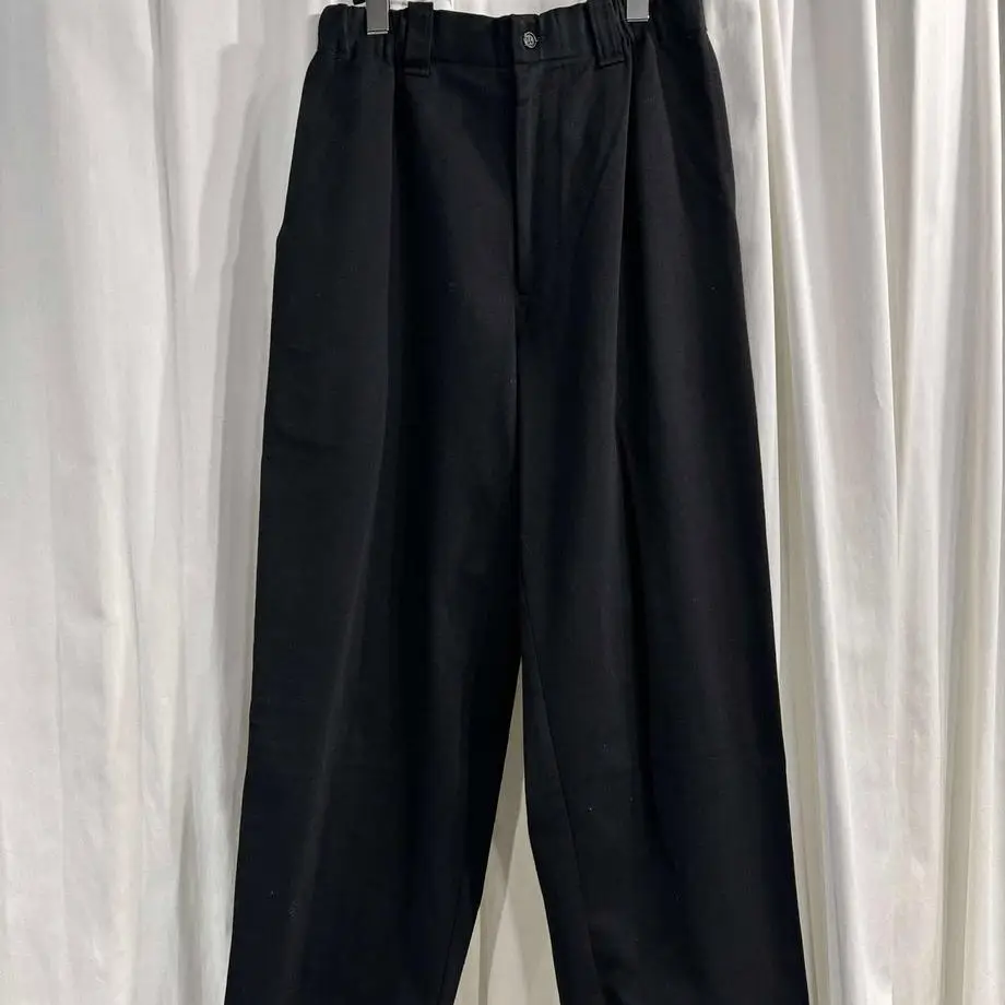 

ТОП-ЯМАМОТО ® Черные костюмные брюки со складками — женские универсальные и утягивающие широкие брюки для повседневной носки.