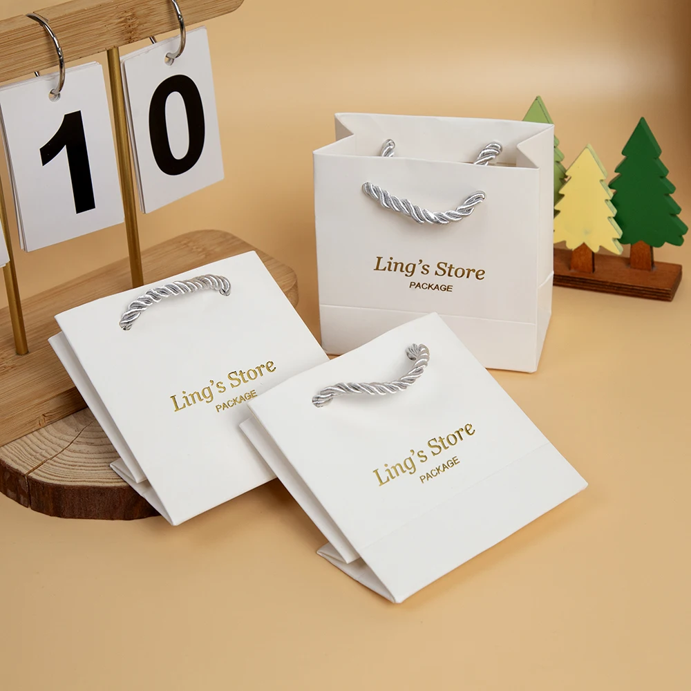 

20/50/100Pcs Custom Logo Small Gift Packaging Jewelry Paper Handle Bag White Beige Navy Purple Handbag Perfume Cosmetic Wig Bags