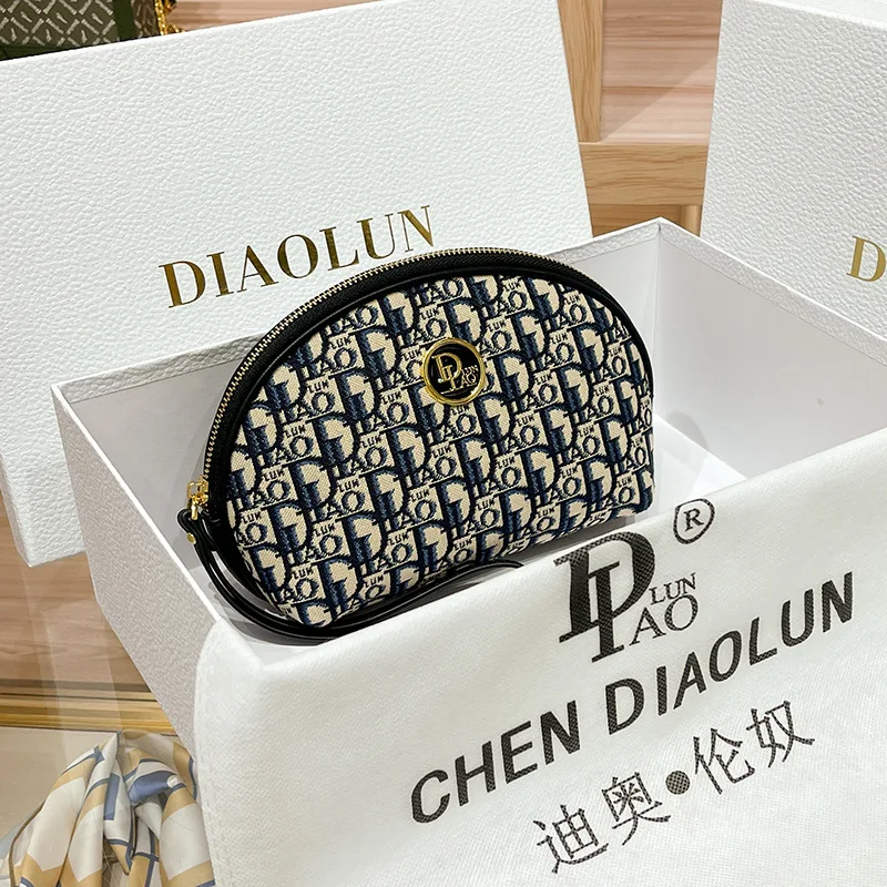 2023 Spring/summer new grip bag advanced sense embroidery printed makeup bag canvas texture hand purse M894