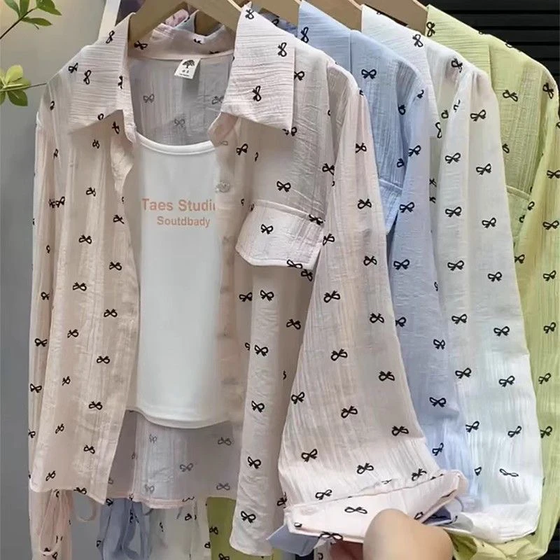 

Summer 2025 Loose Long Sve irt Knot Print Sun Protection Top Korean Sle Commute Faion Polyester Material