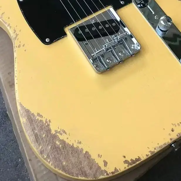 Milk yellow six-string old electric guitar, basswood body, maple neck, black panel support personalized customization.