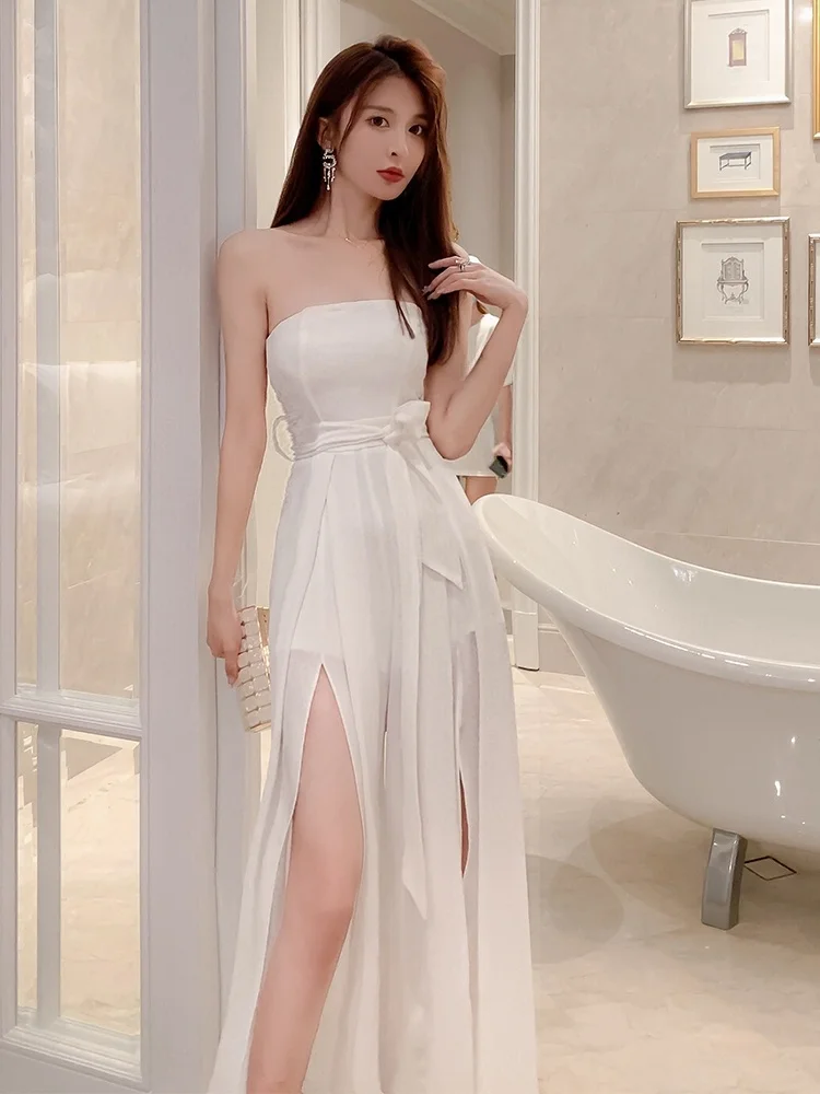 Seksowny biały kombinezon na ramiączkach 2025 Nowy Ele Lady High-End Super Fairy Spodnie z szerokimi nogawkami z rozcięciem, wysoki stan, długie spodnie, model wyszczuplający